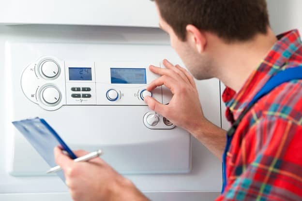 Man fixing the boiler