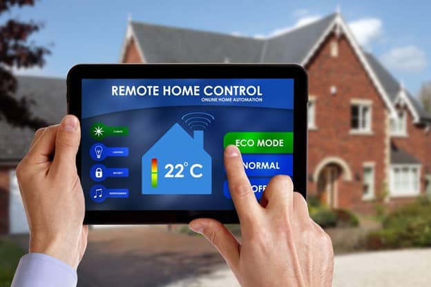 Man using smart remote home control on tablet All screen graphics made up